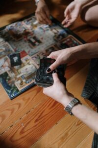 close up shot of a person holding black cards